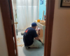 Reliable Cabinets worker installs a new bathroom cabinet with vessel sink